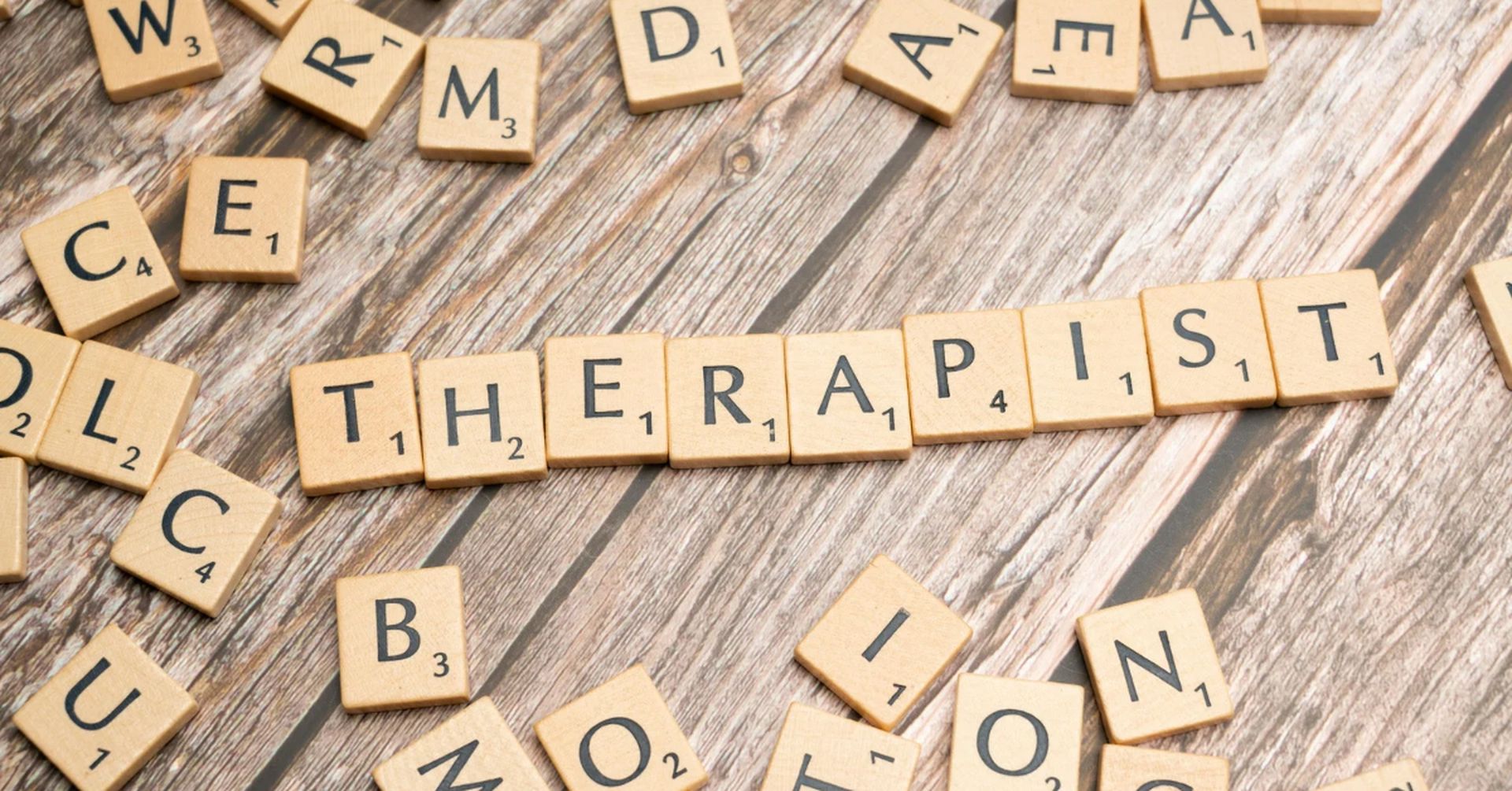 Scrabble tiles spelling the word therapist, representing choosing the right counsellor
