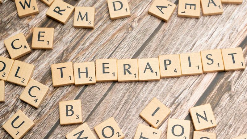 Scrabble tiles spelling the word therapist, representing choosing the right counsellor
